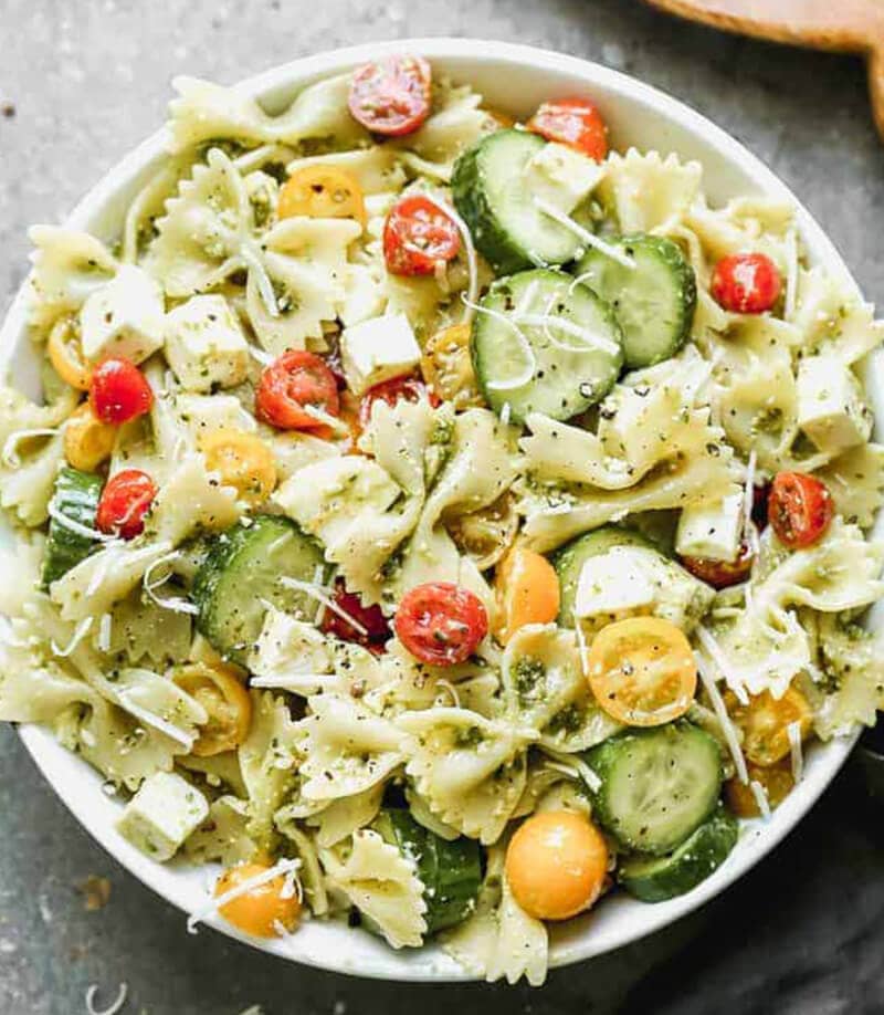 Pesto Pasta Salad served in a white bowl. 