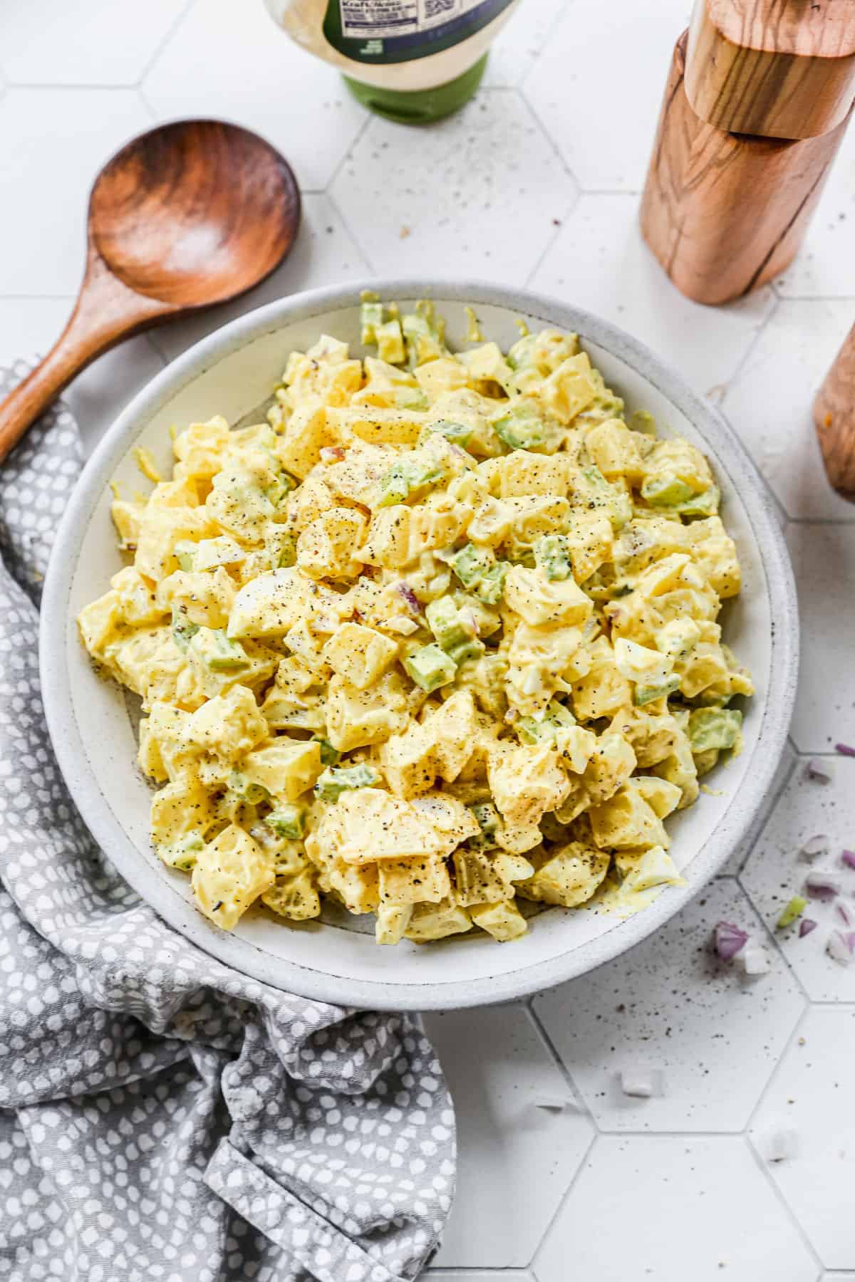 Classic Potato Salad served in a grey bowl and garnished with pepper