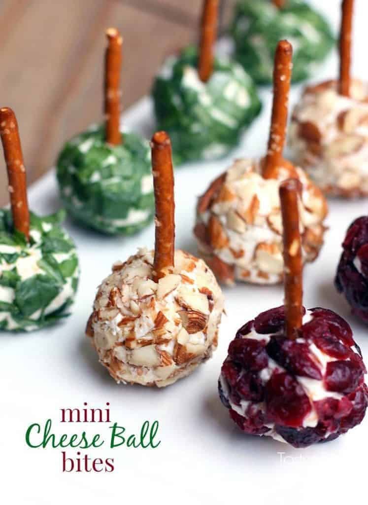 Mini Cheese ball bites topped with a pretzel stick