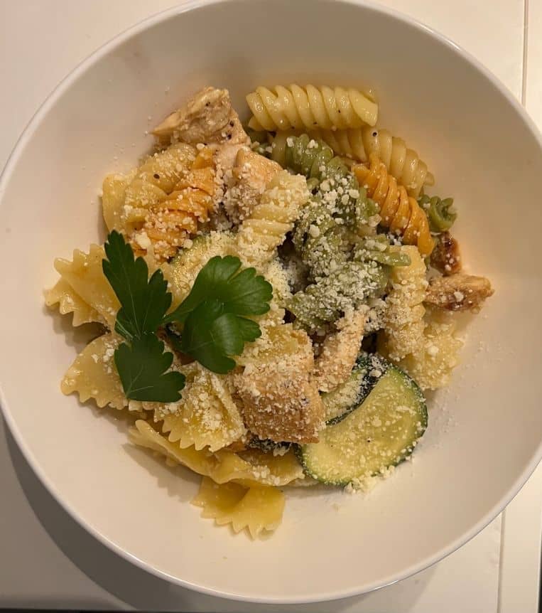 Subscriber image of Lemon Chicken Pasta served in a white bowl and garnished with fresh herbs.