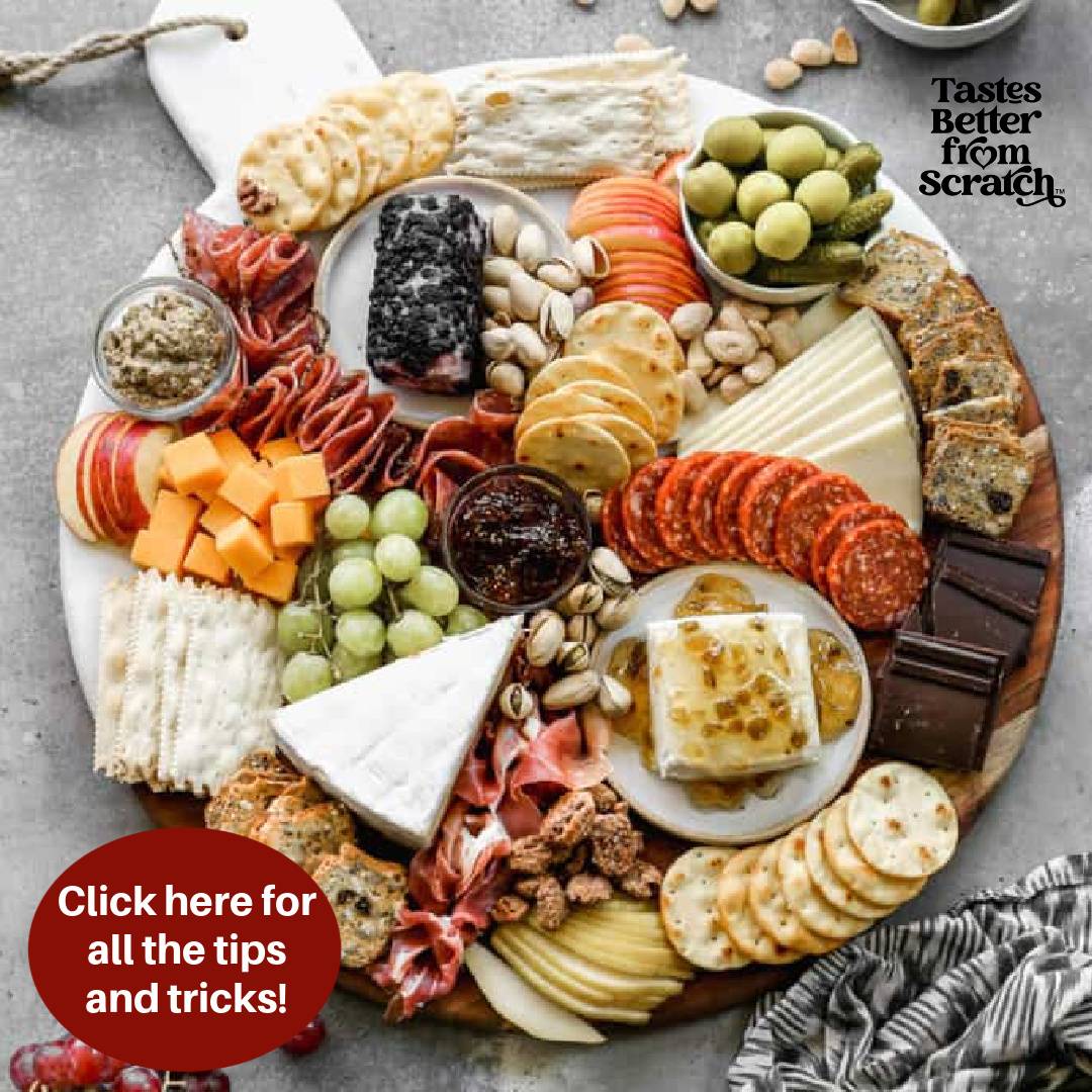 charcuterie (cheese) board displayed on a wood board