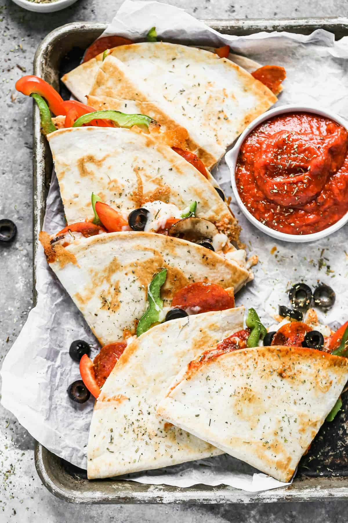 Pizza Quesadilla served with a tomato dipping sauce