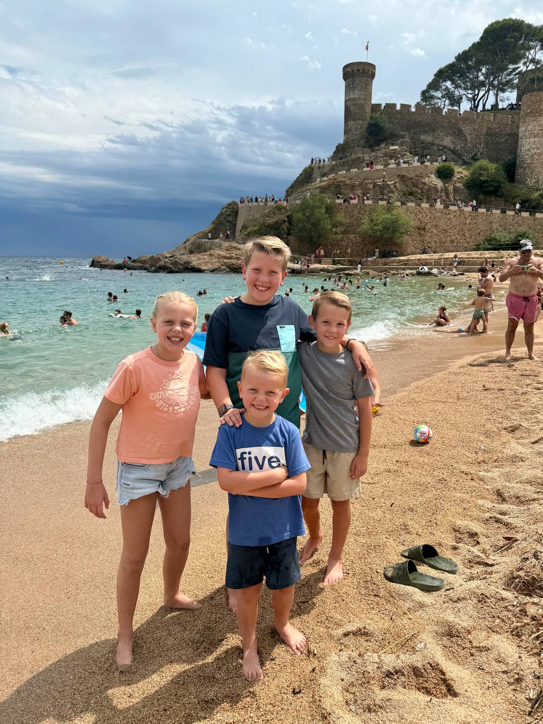 The Allen children on the beach in Tossa de Mar.