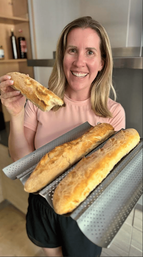 Lauren holding  baguettes.