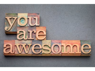 A carved sign that reads You Are Awesome