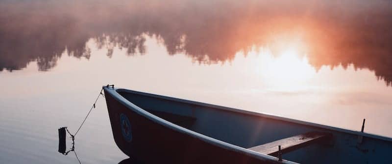 Small boat on calm lake