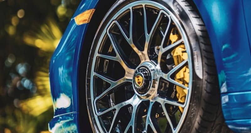blue car with chrome wheel