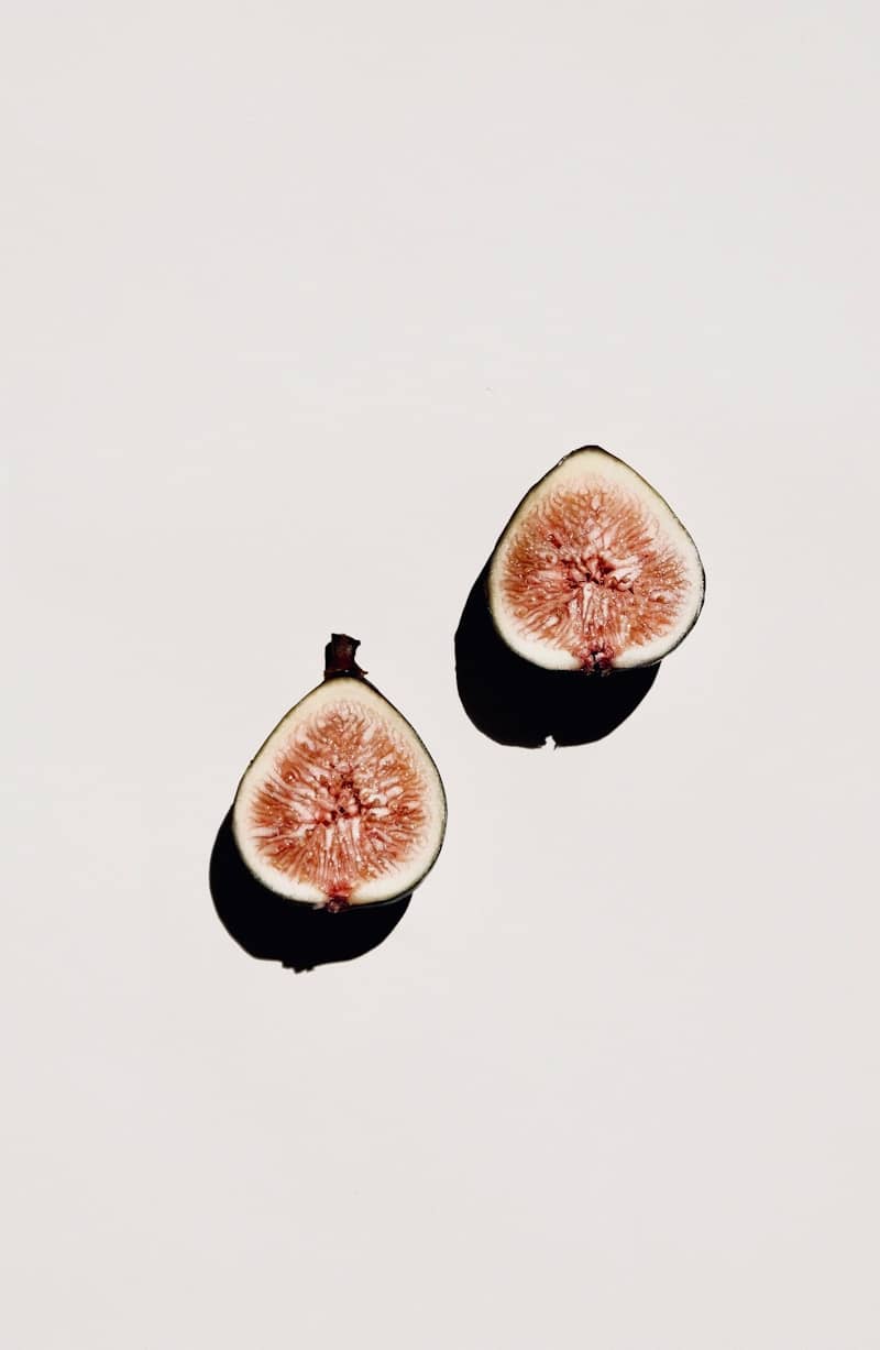 sliced fig on white surface