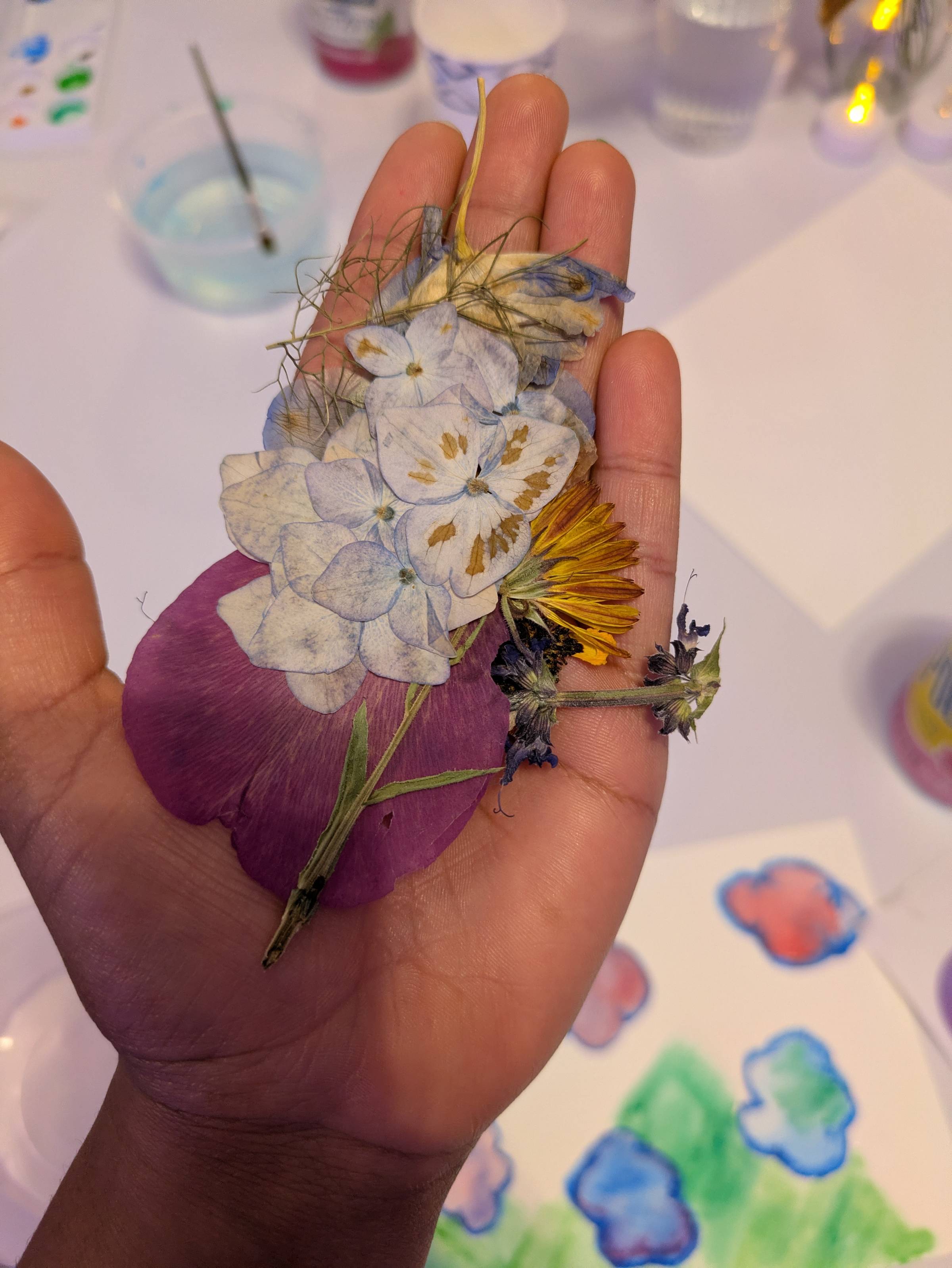 Nivi holding pressed flowers in her hand