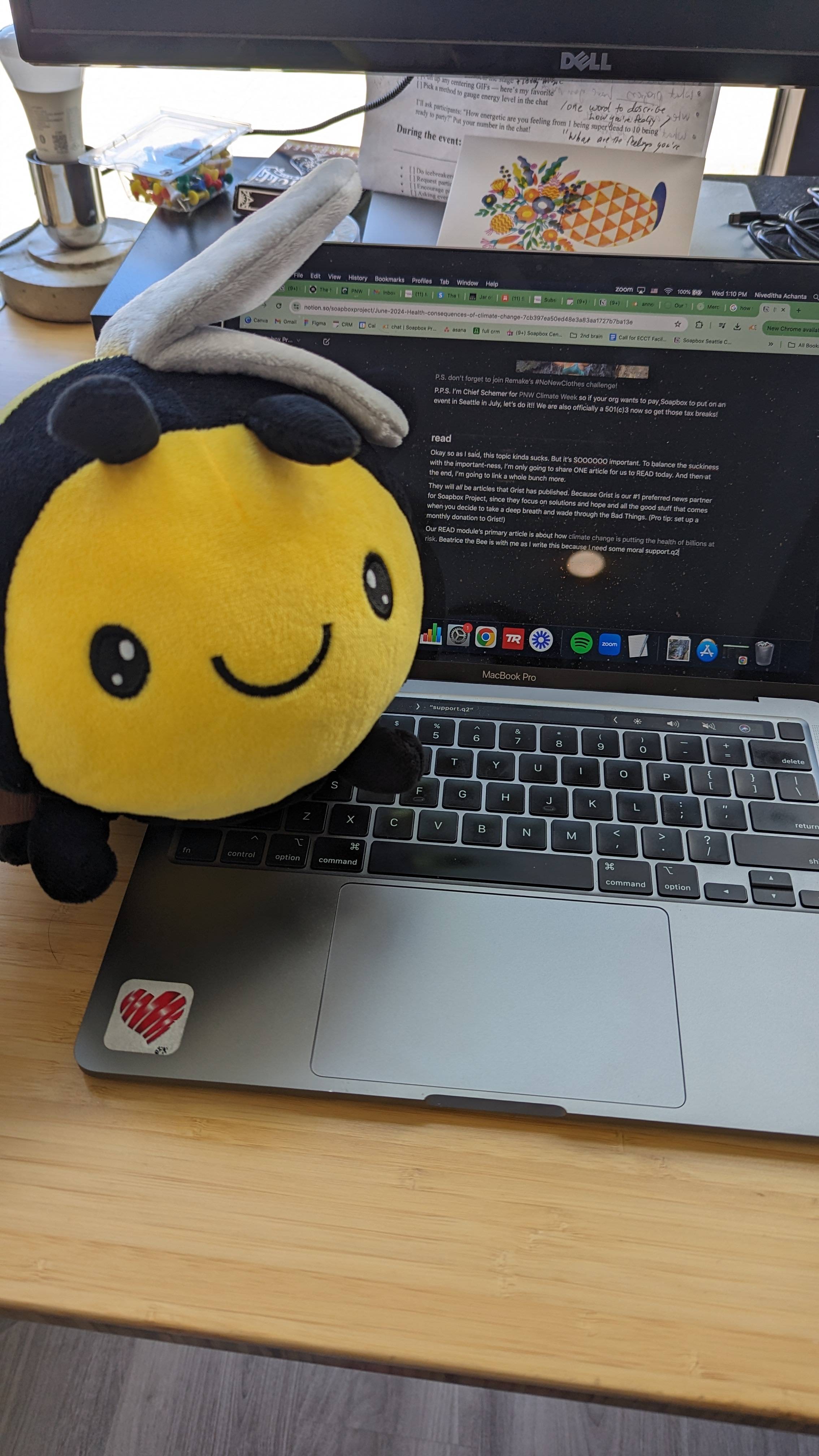 Beatrice the Bee next to Nivi's computer that is writing Changeletter