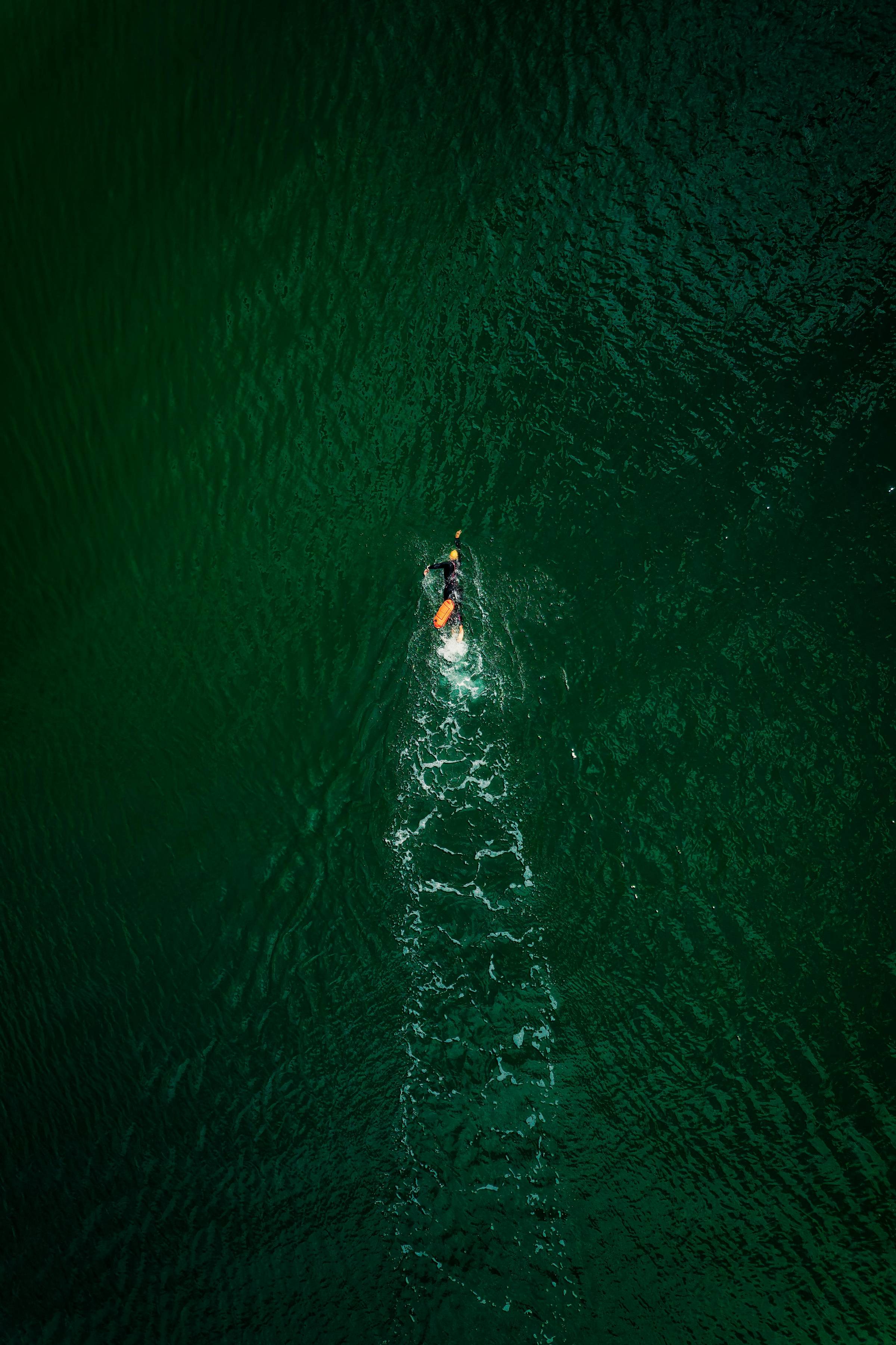 Lone swimmer in the open water