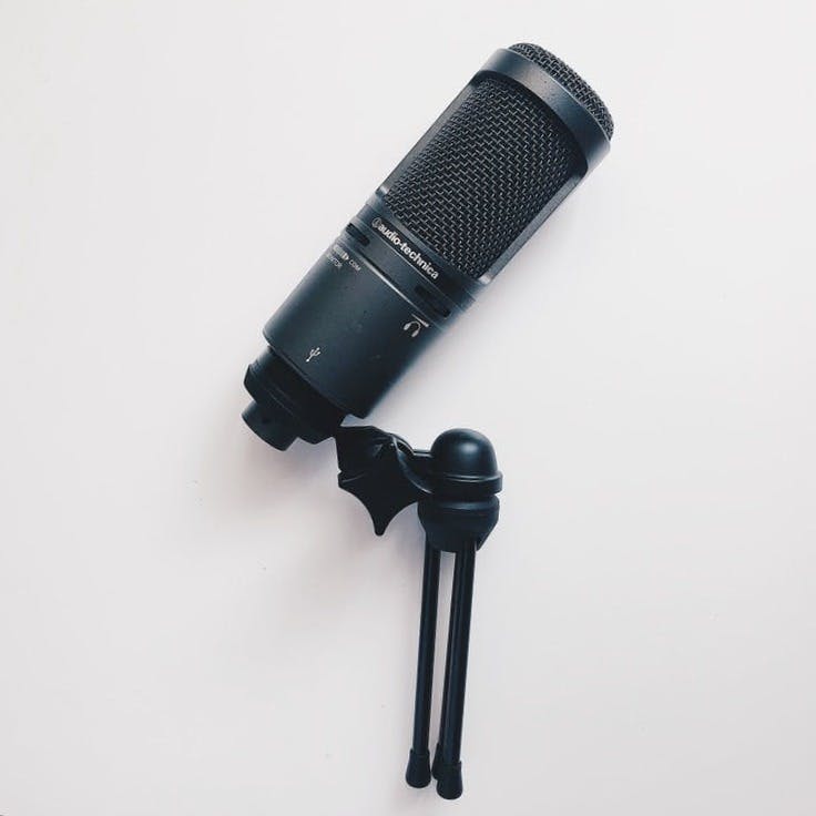 black microphone on white surface