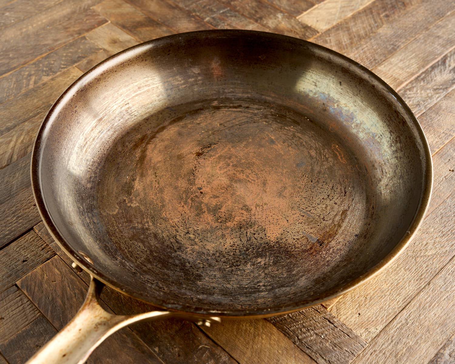 A rusty carbon steel pan
