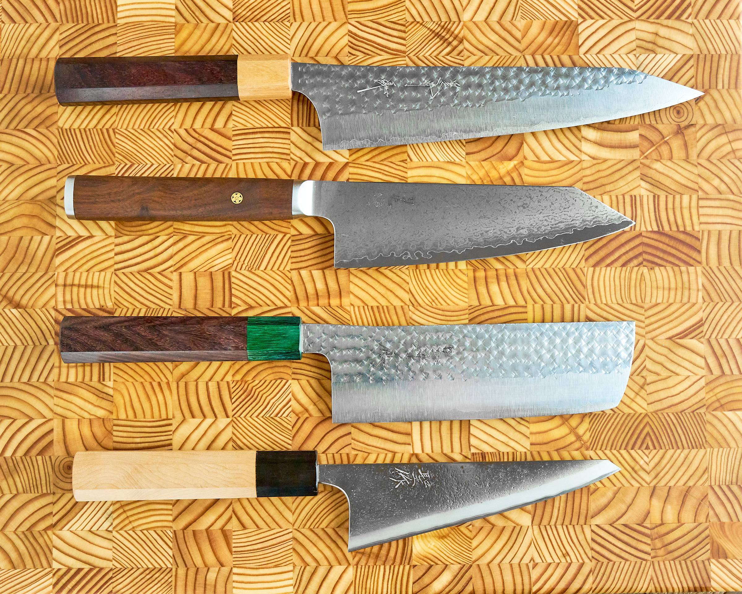 Gyuto, Bunka, Nakiri, Honesuki on a cutting board