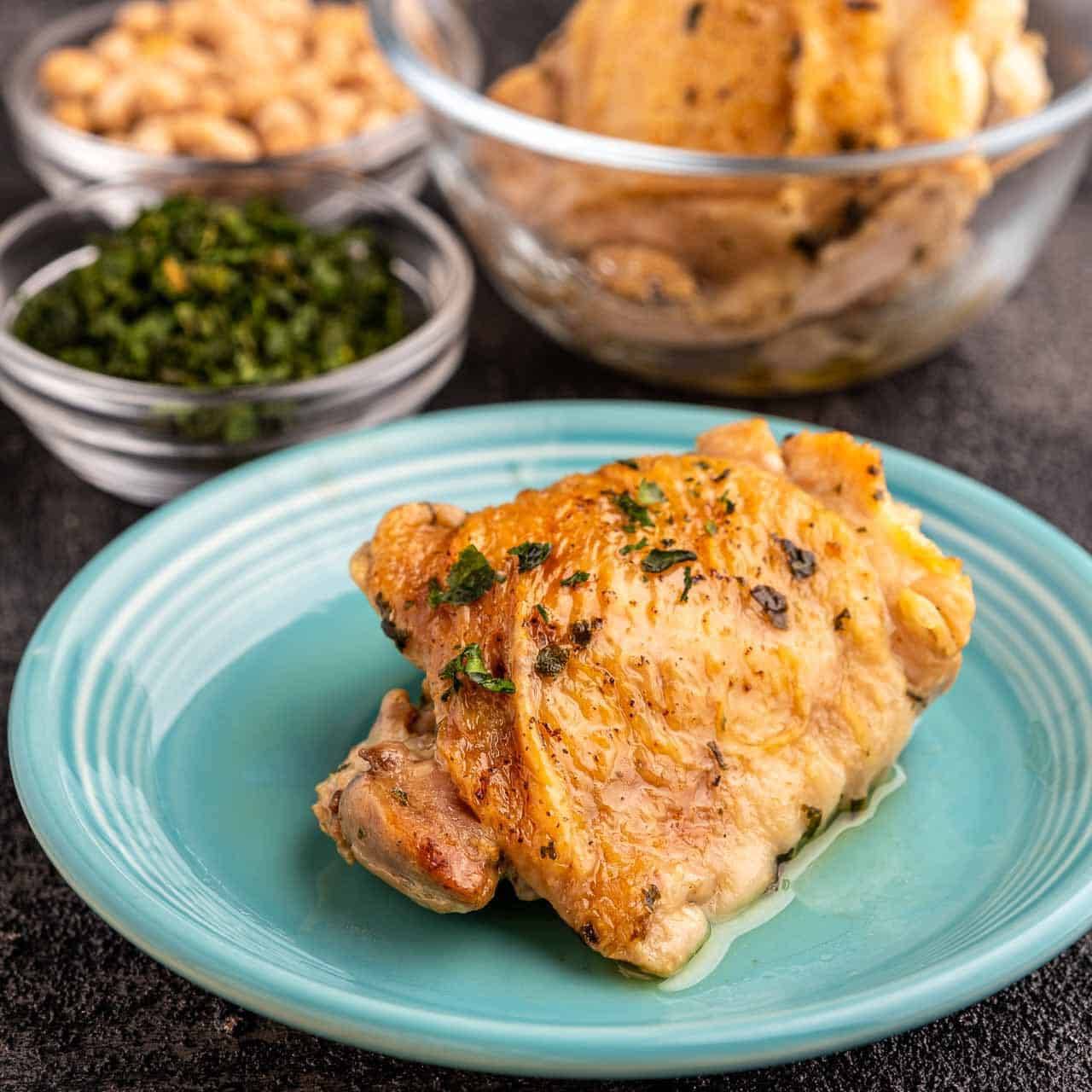 A chicken thigh on a plate
