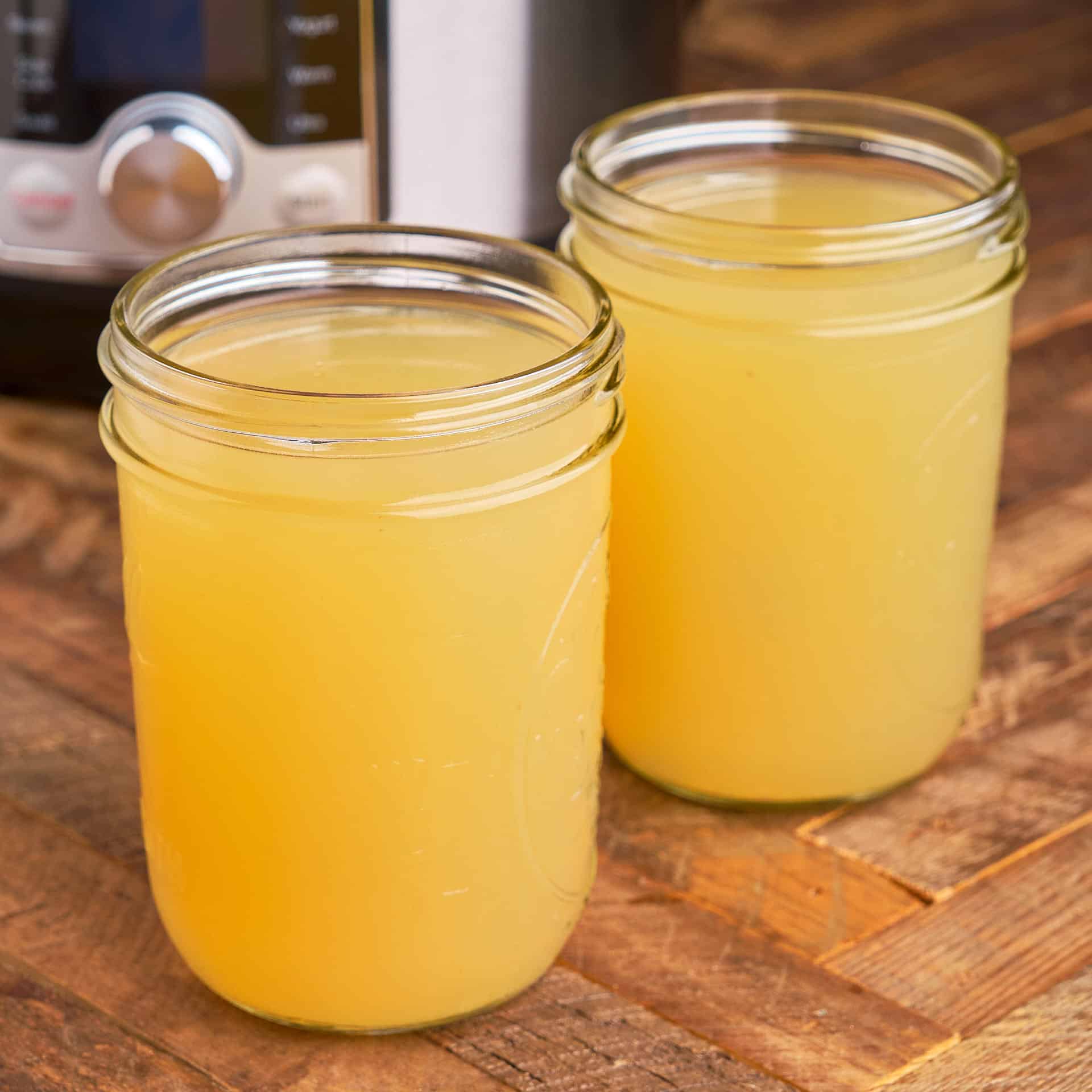 Canning jars of chicken broth