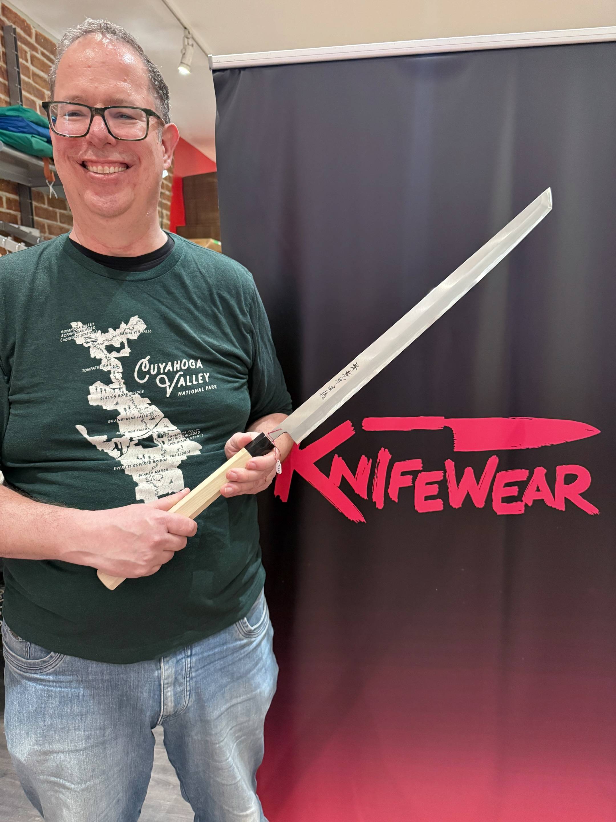 Mike holding a maguro bocho tuna slicing knife
