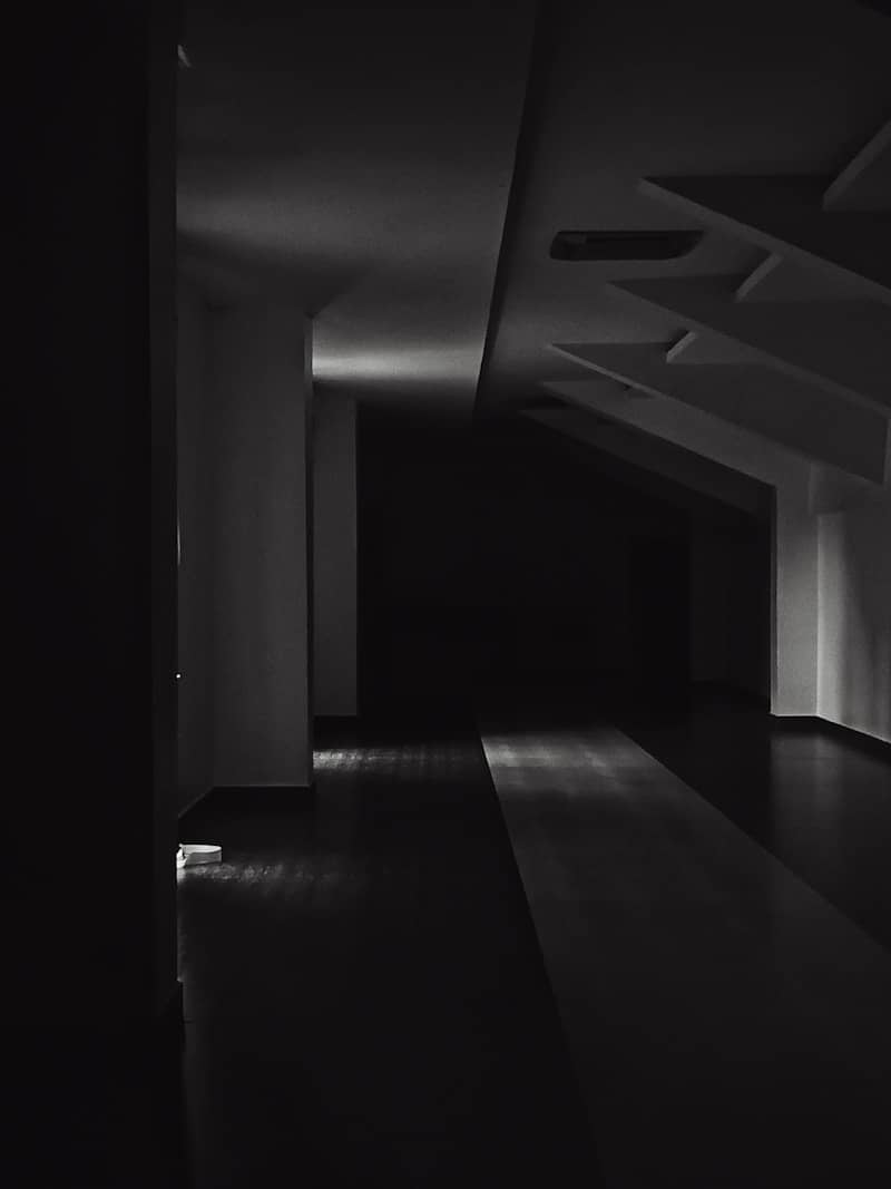 Dark hallway with light illuminating the floor