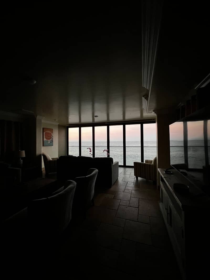 Living room with ocean view at sunset