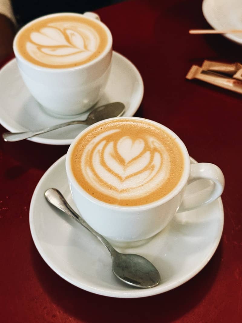 Two cups of coffee with latte art