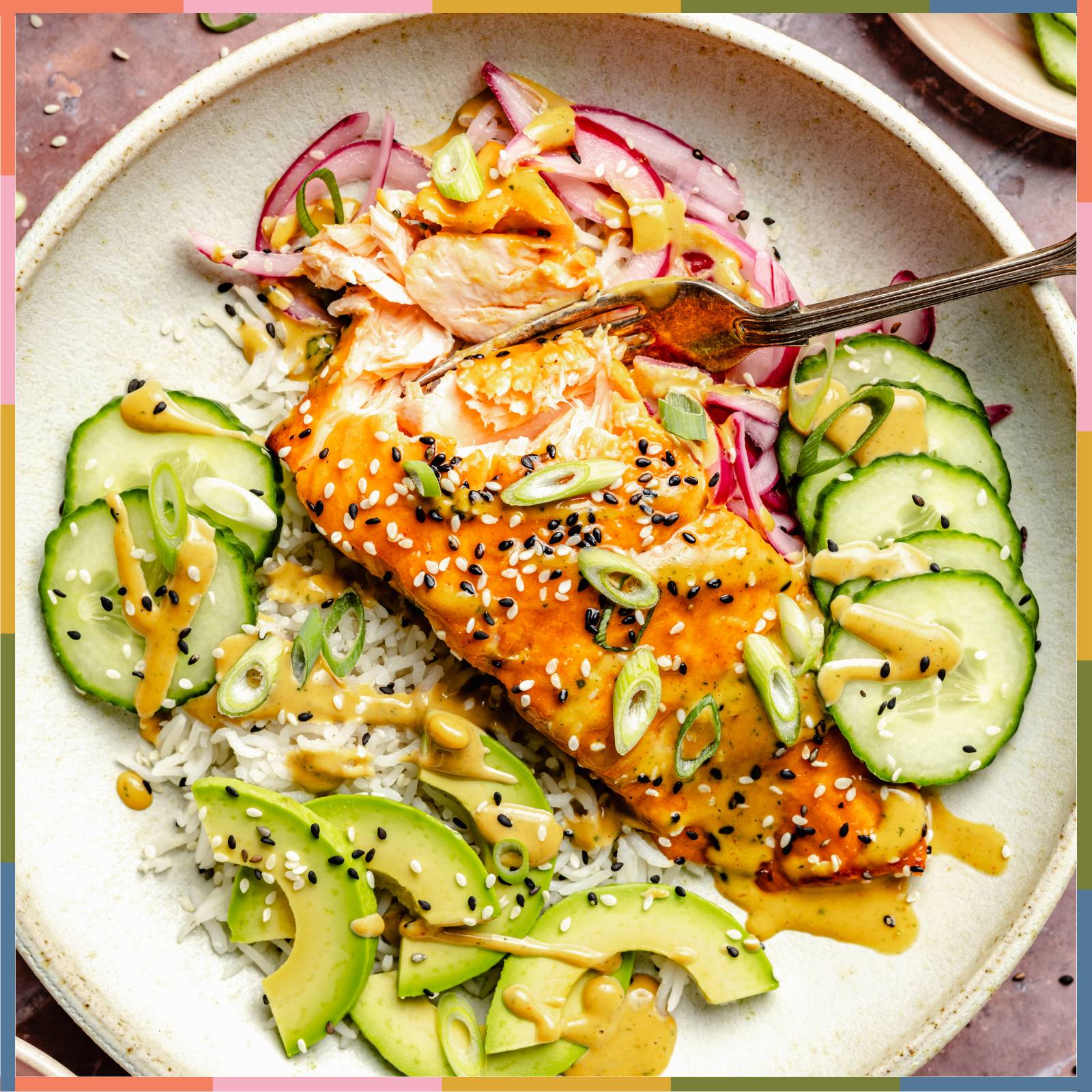 miso glazed salmon in bowl with toppings and sauce