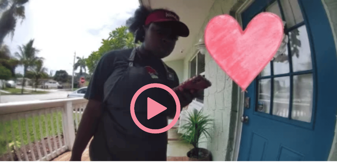 Video: a woman in a Wendy's uniform standing at a front door, with a heart drawn over the doorway.