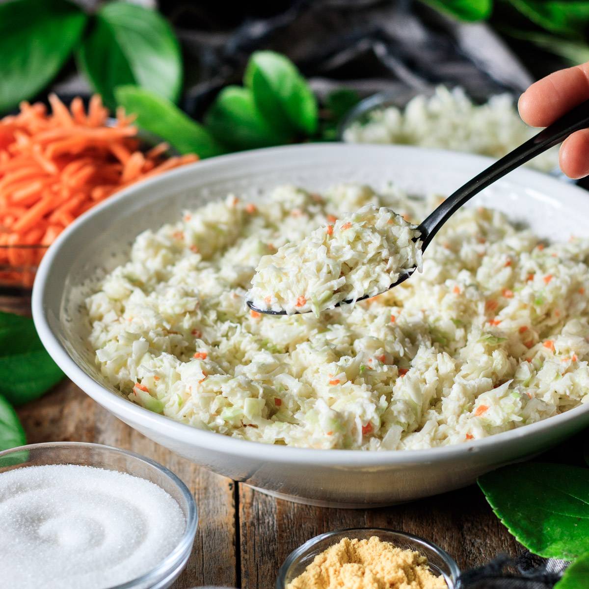 holding a spoonful of Chick-fil-A coleslaw.