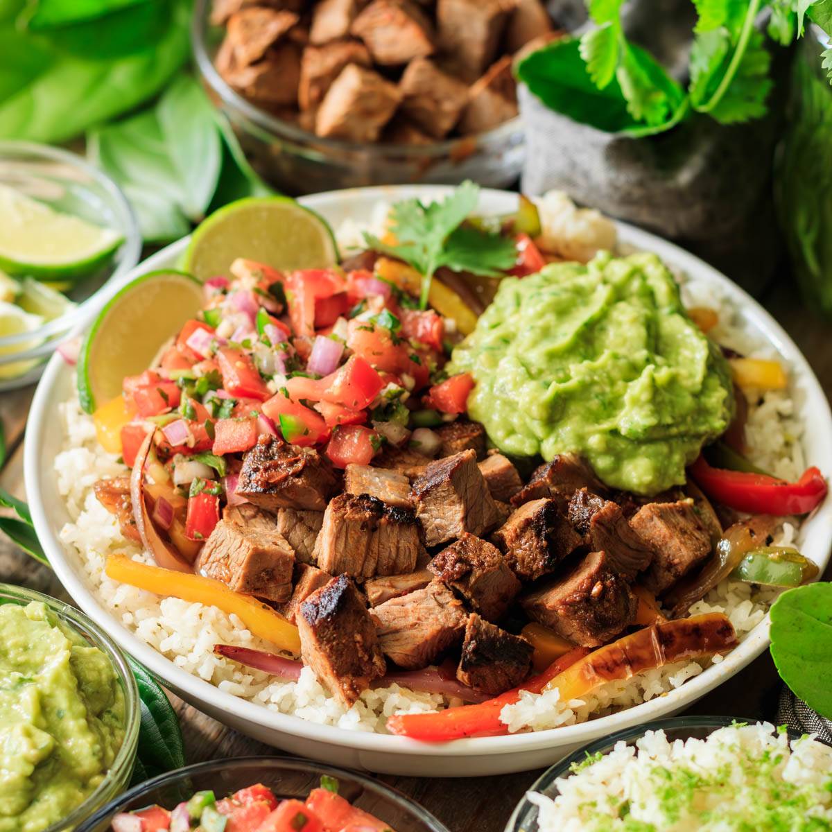 bowl of Chipotle steak with rice, salsa, and guac.