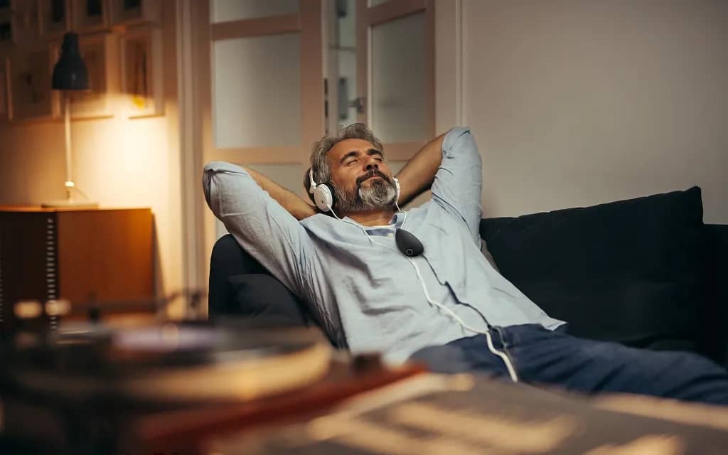 Man enjoying his Sensate 2 and Pulse app. Image courtesy of Sensate.