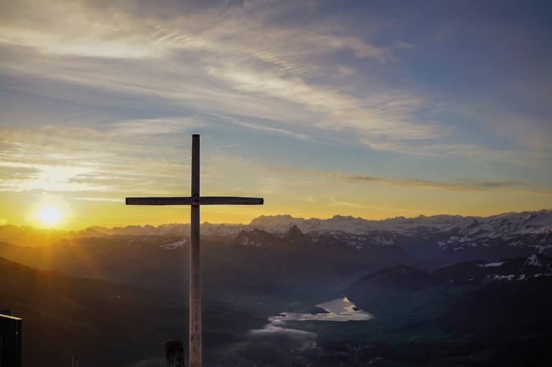 The Cross with the rising sun over it.