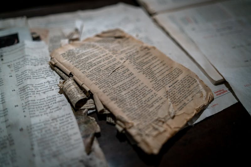 A well used and care-worn sepia colored Bible