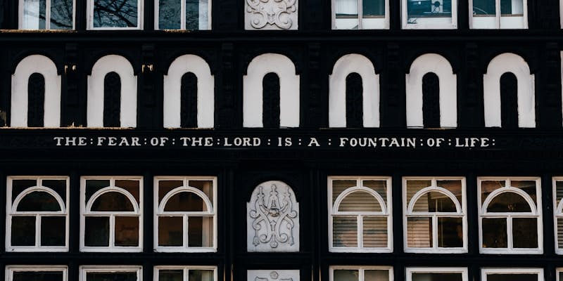 Bible quote on the lintel of a building