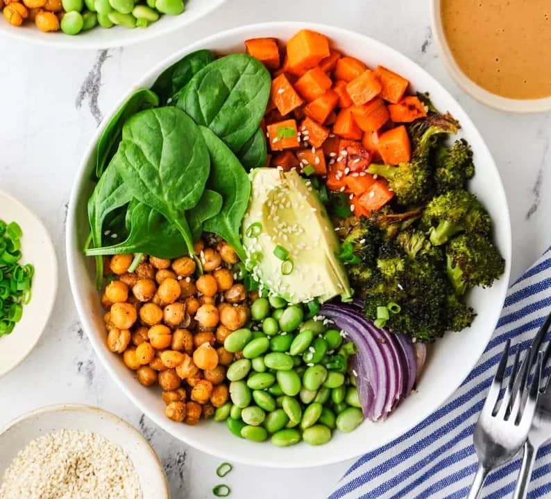Chickpea buddha bowl assembled in a white bowl. 