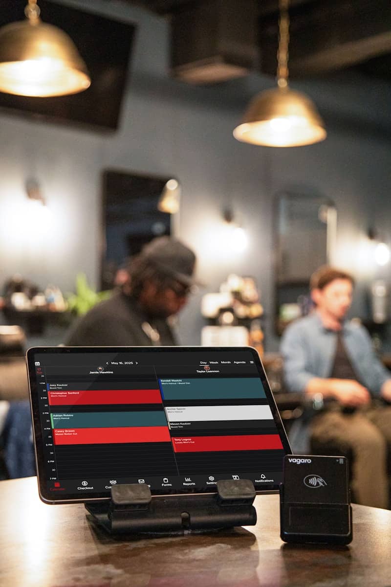 Tablet displays a barber shop's appointment schedule.