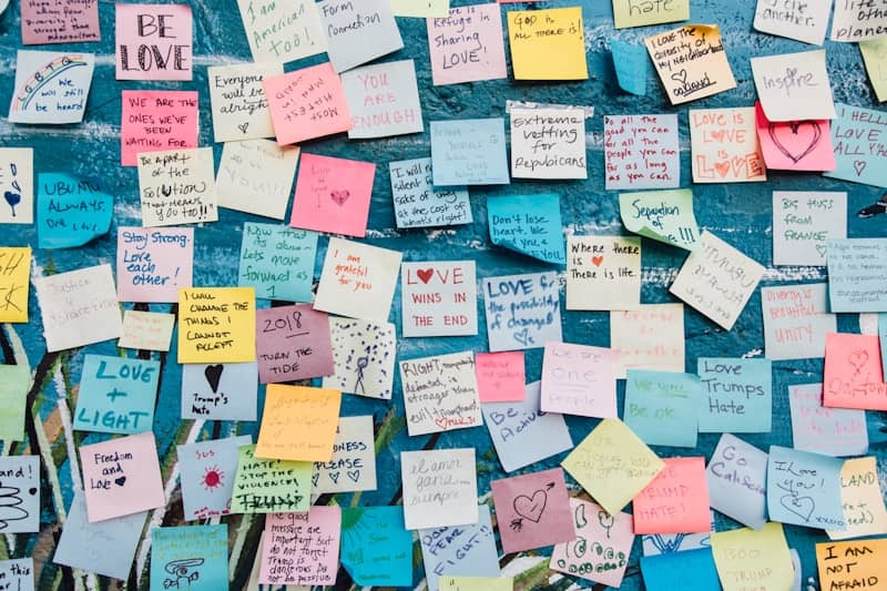 assorted sticky notes on a wall