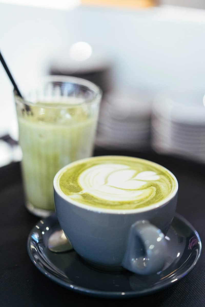 A matcha latte and an iced matcha drink.