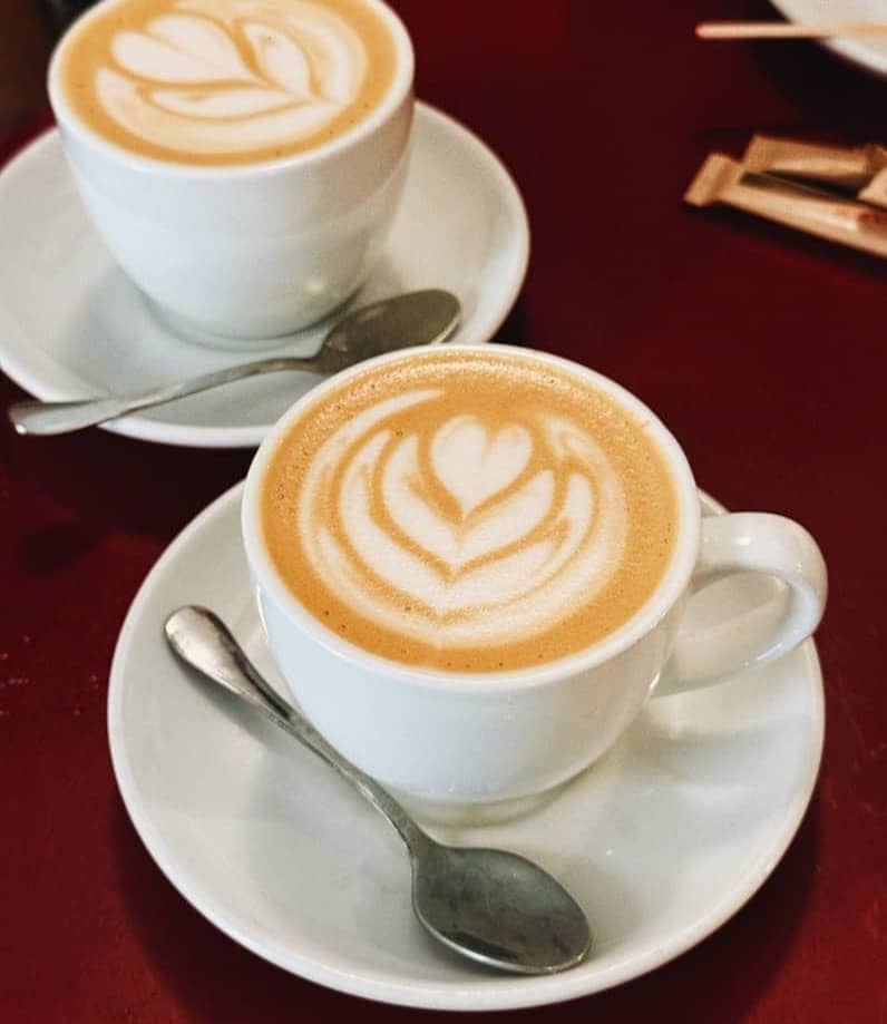 Two cups of coffee with latte art