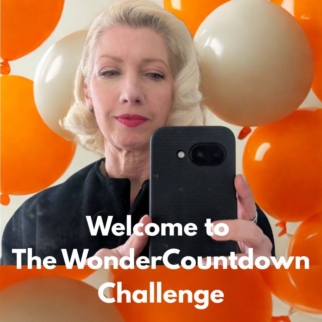 woman looking at phone with balloons in the background