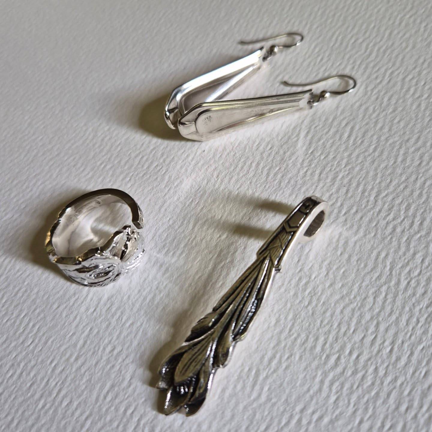 Sold.

A pair of earrings, ring and pendant with a story to tell. For me, the story started in a thrift store, finding forgotten cake forks. But their story started many years before, in someone’s home, long before they became unwanted.

Now they have been transformed into wearable pieces with a whole new life ahead of them.

Erica, the proud new owner’s reaction: “Hi, thank you! Even more beautiful than in the pictures! I just love love love it.”

We first chatted on Facebook, then on WhatsApp. She took a payment plan and 3 months later I sent her beautiful new jewellery. So it truly doesn’t matter where you are, or if you can’t afford the full amount at once, reach out and we will find a solution.

My goal is simply to help forgotten pieces of cutlery find new homes and be loved again 😉