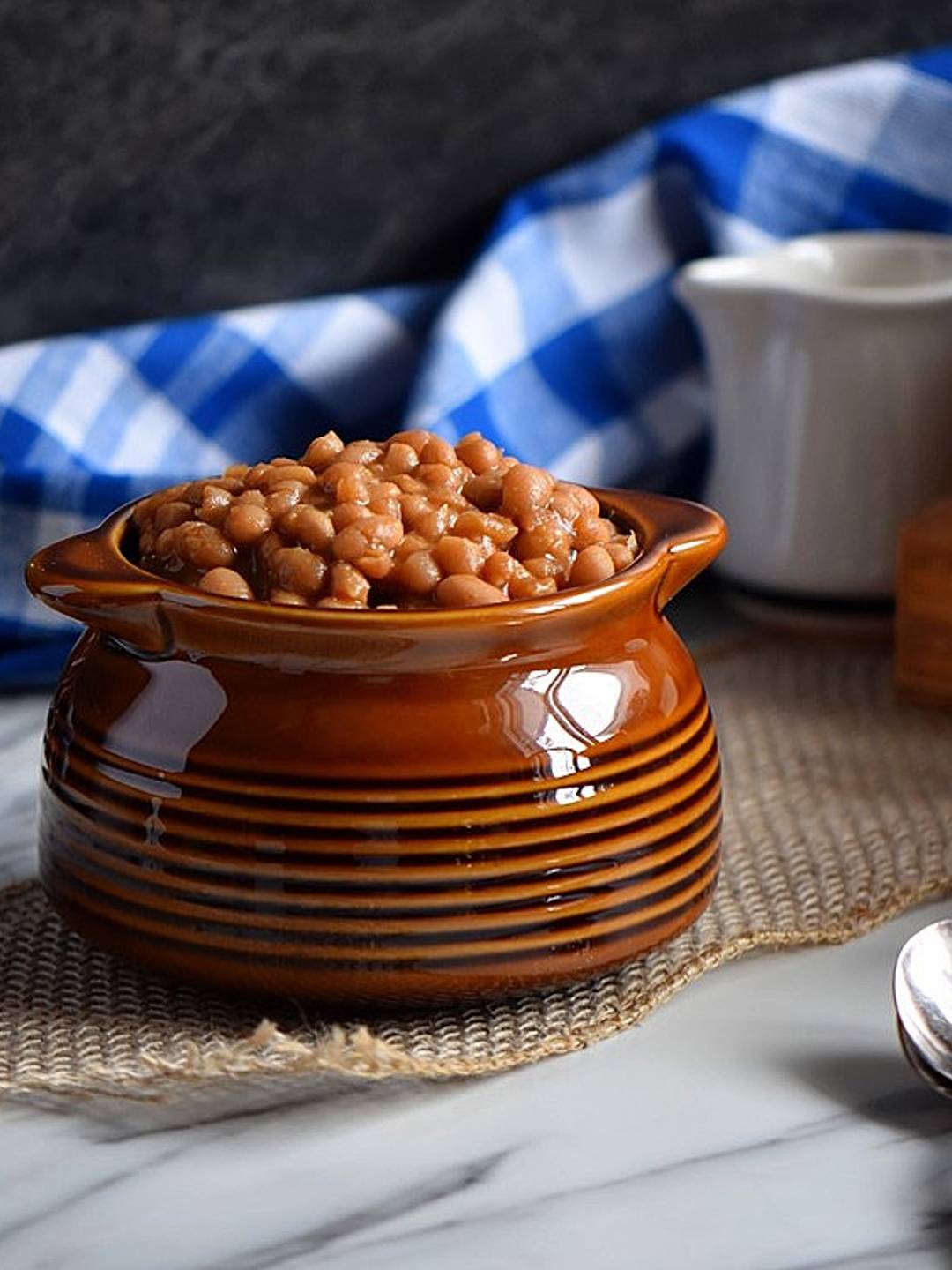 Maple baked beans in a bean pot.