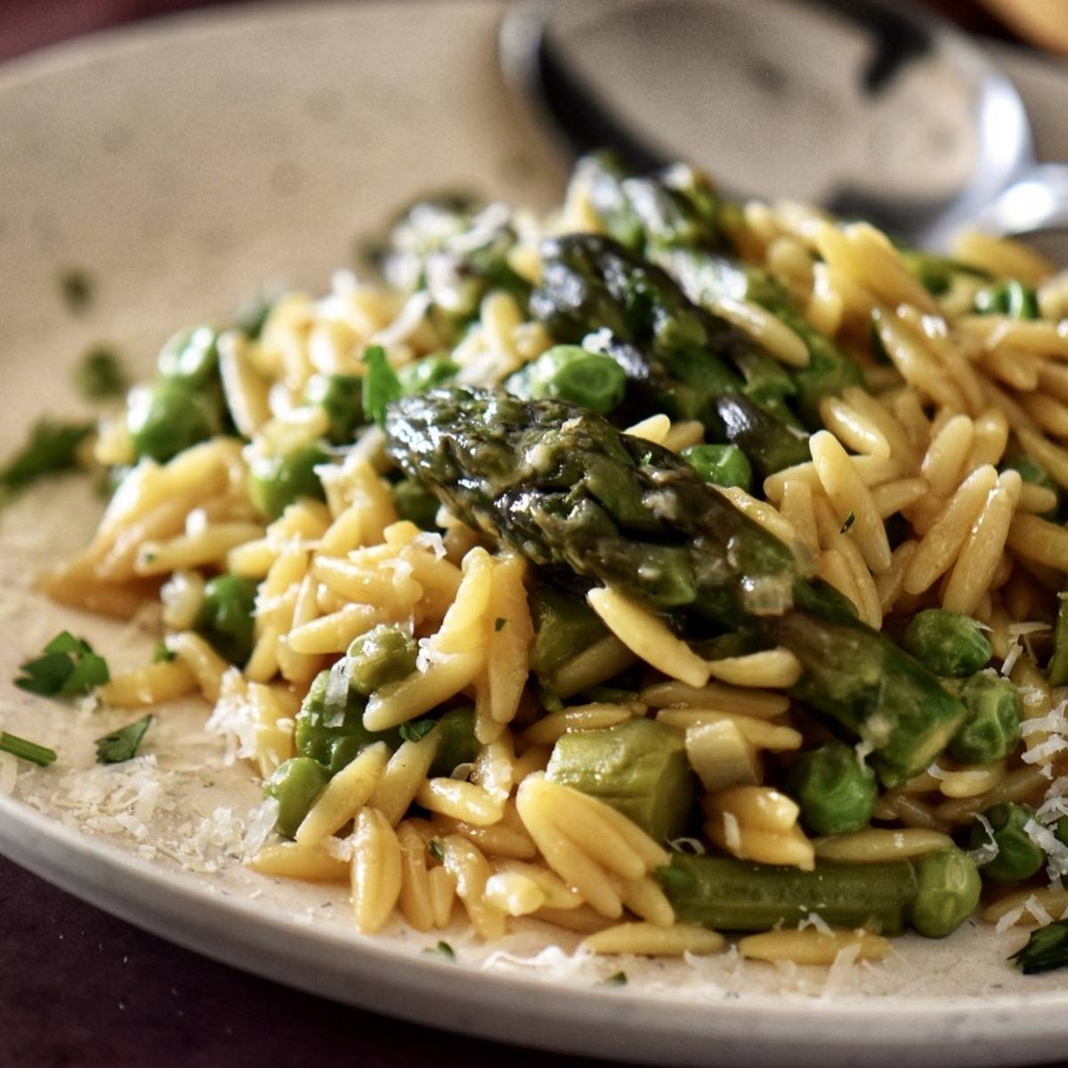 Orzo risotto with peas and asparagus.