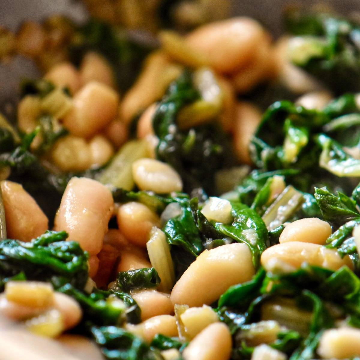 Beans with chard in a pan.
