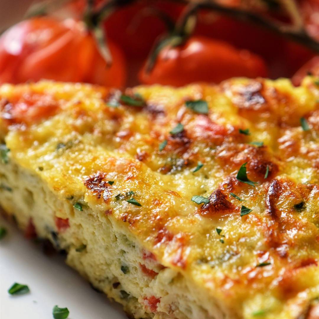 Zucchini frittata on a white plate.