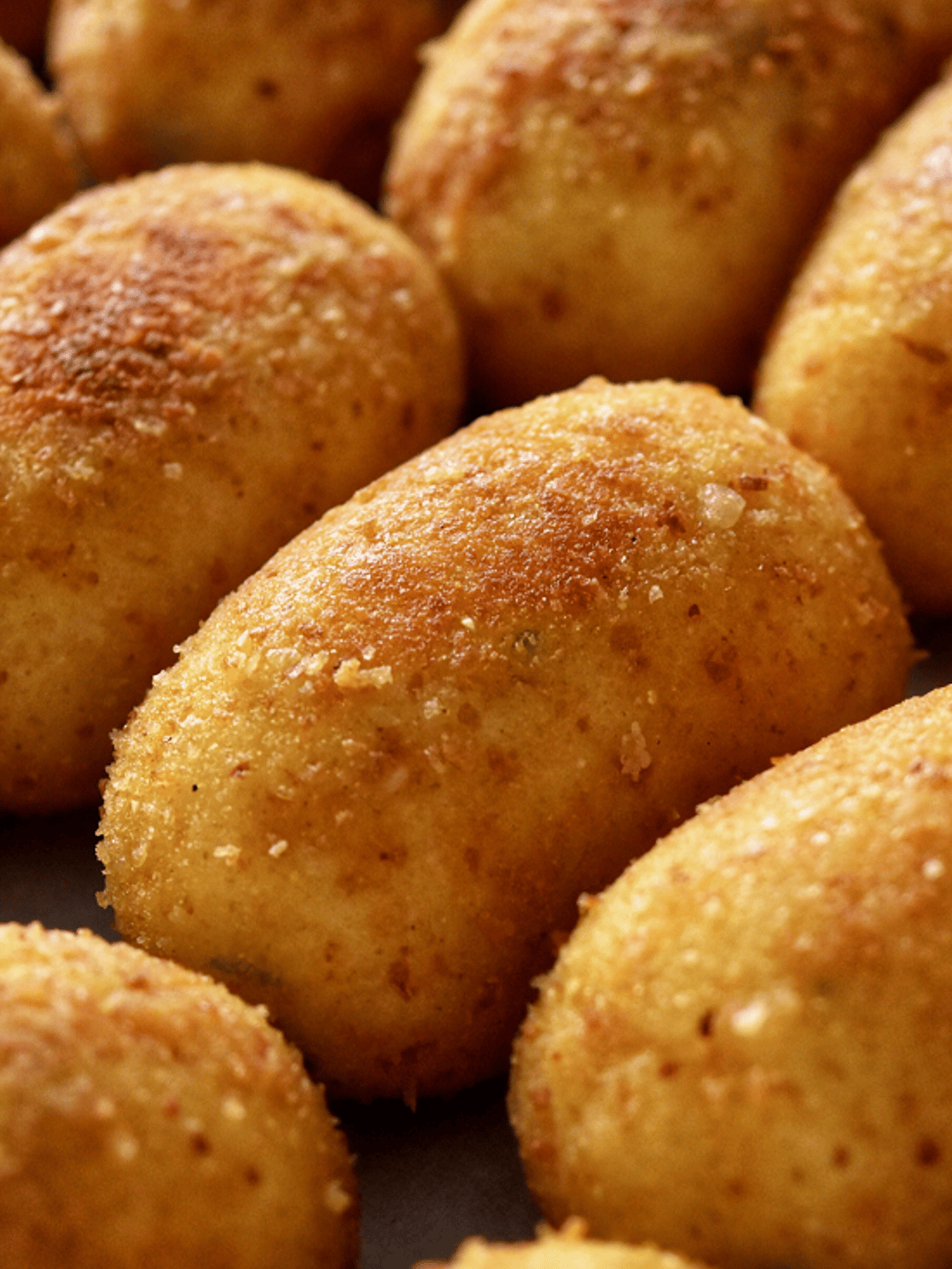 Potato croquettes in a serving dish.