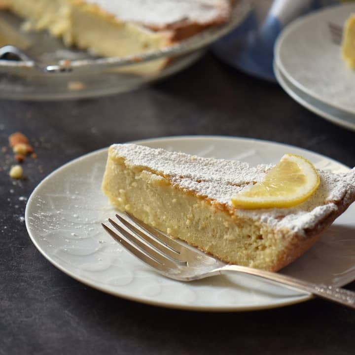 A slice of a traditional Italian Easter Ricotta pie on a white plate.