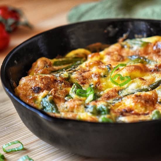 Asparagus frittata in a cast iron pan.