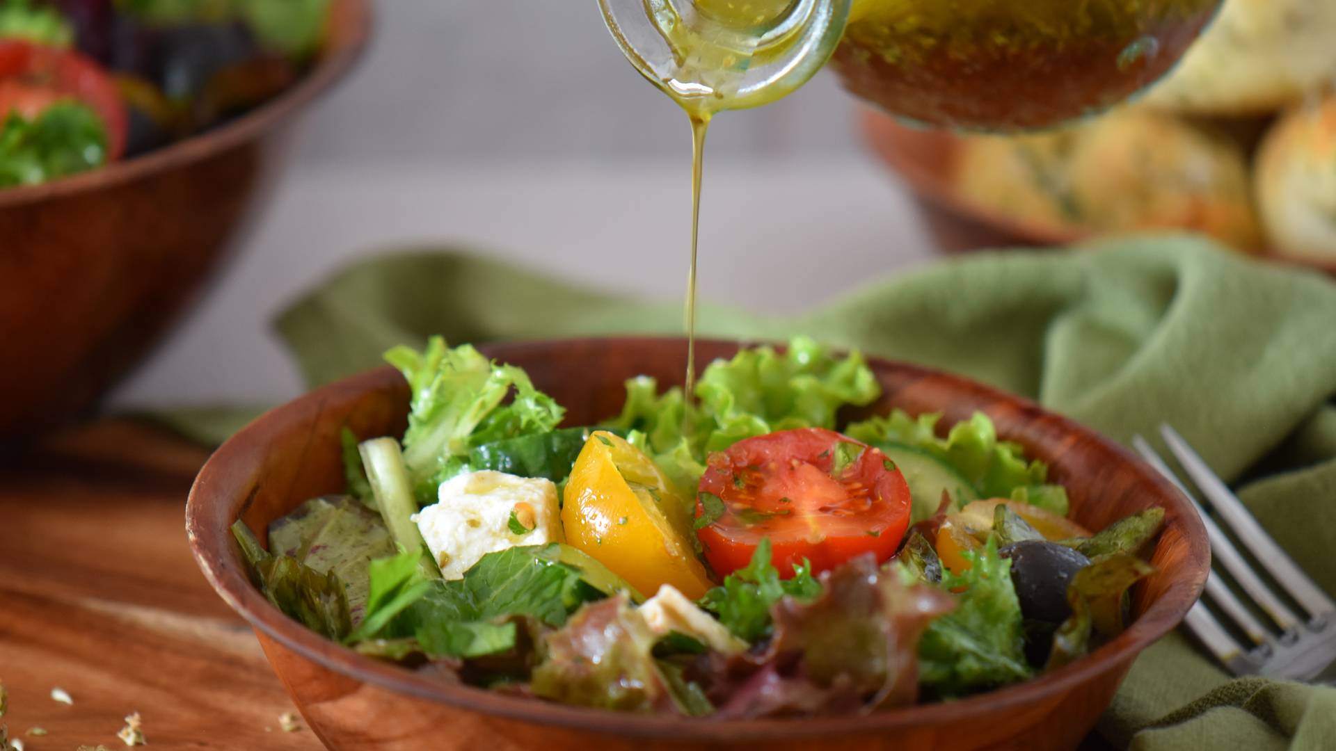 Italian green salad in a wooden bowl.