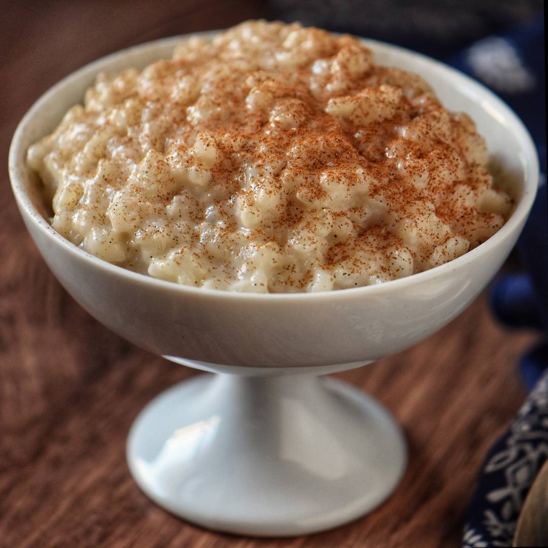 Rice pudding in a white dessert dish.