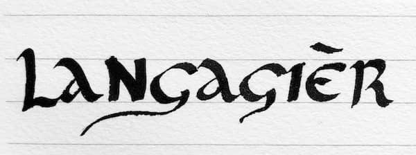 A photo of the word Langagièr, written in a calligraphic script.