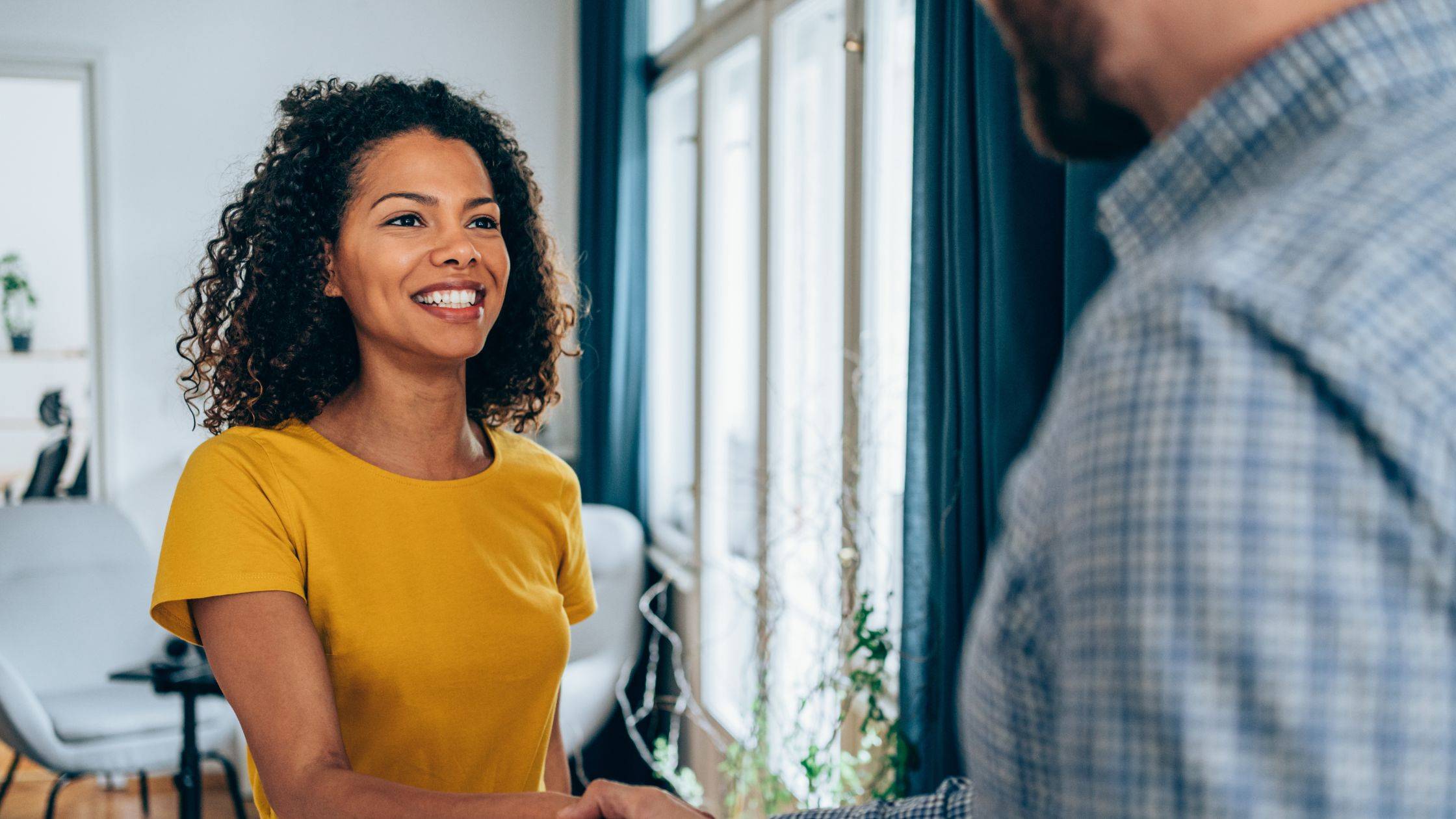 Smiling African American Women Shaking Hands
